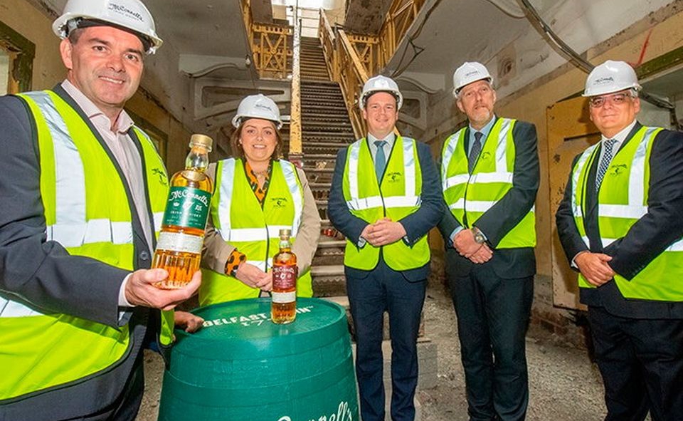 Pictured (L-R) are Belfast Distillery CEO, John Kelly; Communities Minister, Deirdre Hargey; Economy Minister, Gordon Lyons; Infrastructure Minister, John O'Dowd; Invest NI Interim CEO, Mel Chittock.